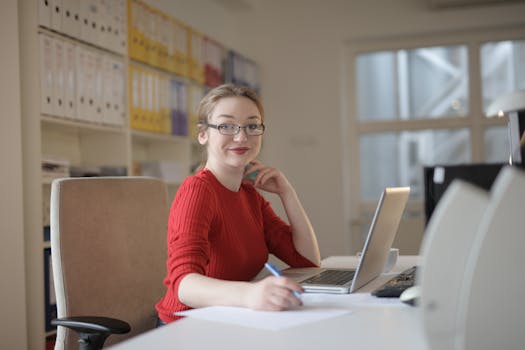 a person looking at a laptop with a confused expression